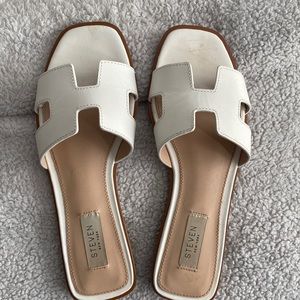 Lightly worn STEVEN sandals in white